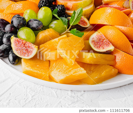 Exotic fruits platter isolated on white Exotic fruits platter isolated on white 111611706
