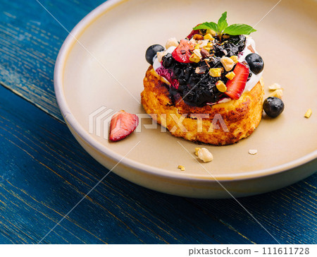 one cottage cheese pancake with jam and sour cream one cottage cheese pancake with jam and sour cream 111611728