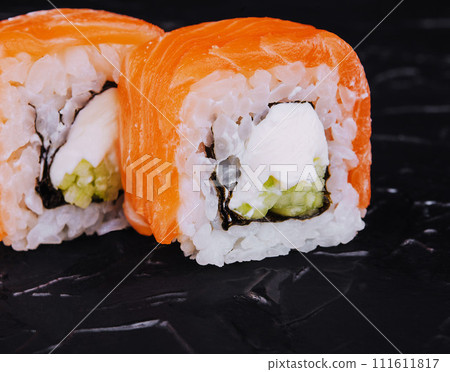 Salmon sushi with rice, philadelphia cheese and cucumber Salmon sushi with rice, philadelphia cheese and cucumber 111611817