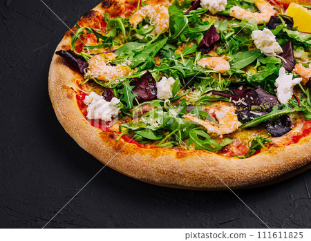 pizza with shrimp, arugula and cream 111611825