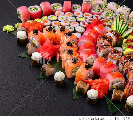 Large sushi set on a black stone 111611949