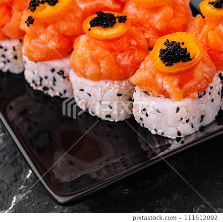 Maki Sushi - Roll topped with Sliced Spicy Salmon 111612092