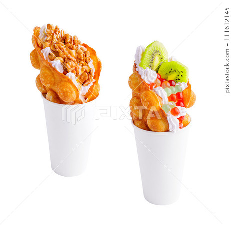 Bubble Waffle with kiwi, bubble tea, nuts and whipped cream Bubble Waffle with kiwi, bubble tea, nuts and whipped cream 111612145