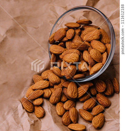 almonds in a white glass bowl almonds in a white glass bowl 111612188