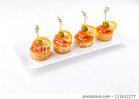 Salmon rolled fillet in pastries isolated on white 111612277
