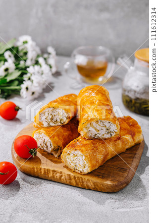 Cooking traditional pies with cottage cheese on wooden table Cooking traditional pies with cottage cheese on wooden table 111612314