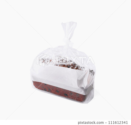 Loaf of wheat bread in plastic bag isolated 111612341