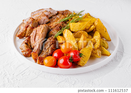 Grilled kebab pork meat with roasted potato and vegetables 111612537