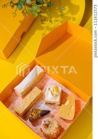 Christmas gifts presents with different cakes on yellow box 111612573