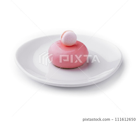 Pink mousse cake decorated with white macaroon Pink mousse cake decorated with white macaroon 111612650