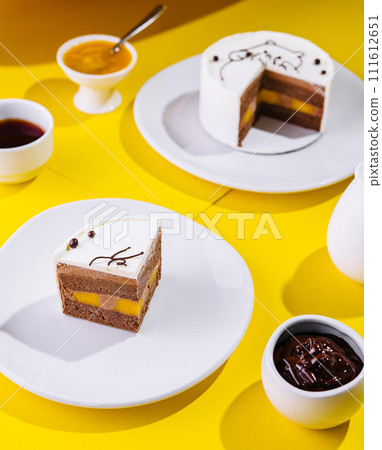 top view of a cream cake on white plate 111612651