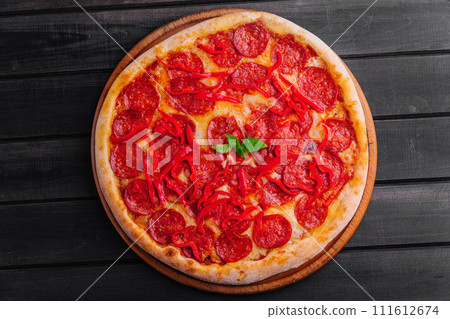 tasty pepperoni pizza with red bell peper 111612674