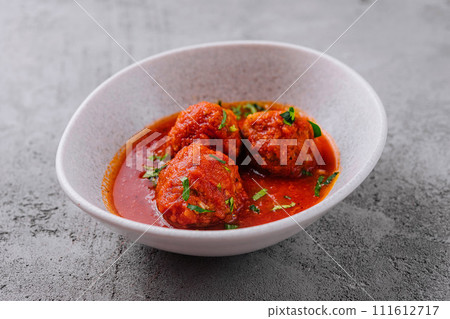 Meatballs with tomato sauce and parsley Meatballs with tomato sauce and parsley 111612717