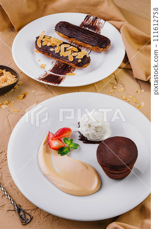 lava cake with ice cream and chocolate eclairs lava cake with ice cream and chocolate eclairs 111612758