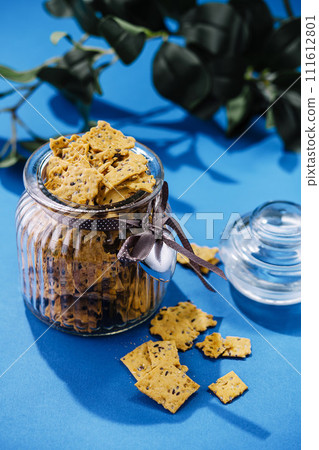 Crispy cookies with sesame seeds in a glass Crispy cookies with sesame seeds in a glass 111612801