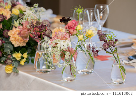 Table decoration flower arrangement decorated with colorful fresh flowers Table decoration flower arrangement decorated with colorful fresh flowers 111613062
