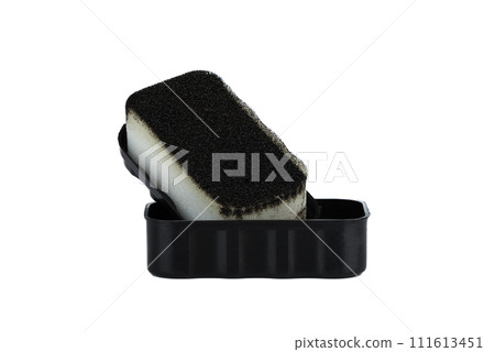 Black shoe care sponge on a white background. 111613451