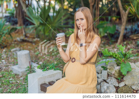 A pregnant woman doubts whether she should drink coffee during pregnancy 111614470
