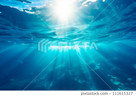 Underwater view of blue surface of ocean or sea. Abstract waves underwater and rays of sunlight 111615327