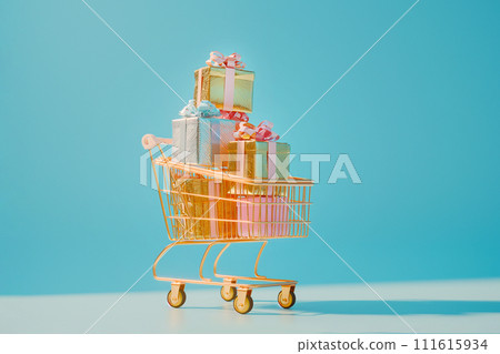 Shopping cart with gift boxes. Golden shopping basket full of gifts on blue background. Sale, Black Friday concept, shopping season, purchase, discounts, shopaholic. Promotion, marketing, copy space Shopping cart with gift boxes. Golden shopping basket full of gifts on blue background. Sale, Black Friday concept, shopping season, purchase, discounts, shopaholic. Promotion, marketing, copy space 111615934
