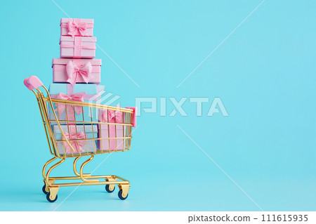 Shopping cart with gift boxes. Golden shopping basket full of gifts on blue background. Sale, Black Friday concept, shopping season, purchase, discounts, shopaholic. Promotion, marketing, copy space Shopping cart with gift boxes. Golden shopping basket full of gifts on blue background. Sale, Black Friday concept, shopping season, purchase, discounts, shopaholic. Promotion, marketing, copy space 111615935