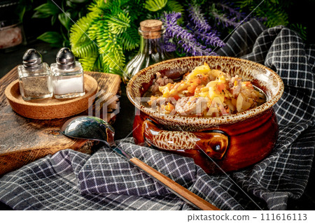 Pea soup with pieces of white sausage, potatoes and small dumplings. 111616113