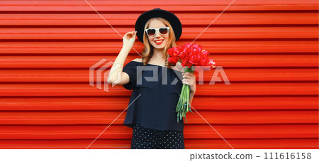 Beautiful happy smiling woman with bouquet of red rose flowers Beautiful happy smiling woman with bouquet of red rose flowers 111616158