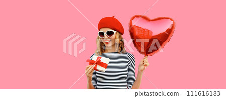 Cute portrait of happy smiling woman with red heart shaped balloon and gift box Cute portrait of happy smiling woman with red heart shaped balloon and gift box 111616183