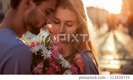 Lovers, dating young adults, meeting after long separation on the street in Venice on warm spring evening. Sweet comfort of touch, newlyweds with a bouquet of flowers, happy couple on Valentine's day Lovers, dating young adults, meeting after long separation on the street in Venice on warm spring evening. Sweet comfort of touch, newlyweds with a bouquet of flowers, happy couple on Valentine's day 111616735