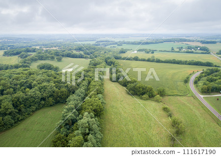 aerial view of Katy Trail shaded by trees near Pilot Grove, Missouri - 237 mile bike trail stretching across most of the state of Missouri converted from abandoned railroad 111617190
