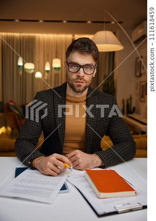 Serious focused business man looking at camera webcam view 111618459