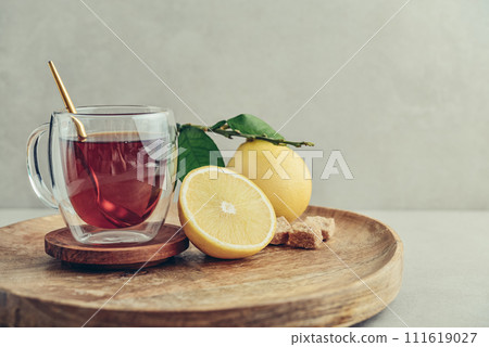 Tea in a glass cup with fresh bergamot orange fruits Tea in a glass cup with fresh bergamot orange fruits 111619027