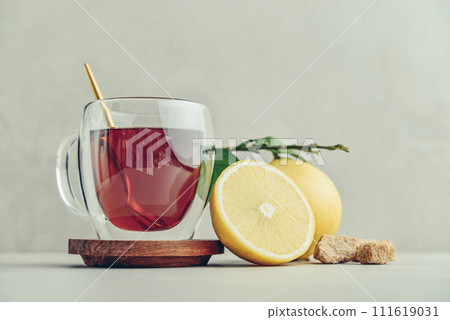 Tea in a glass cup with fresh bergamot orange fruits Tea in a glass cup with fresh bergamot orange fruits 111619031