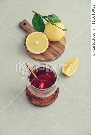 Tea in a glass cup with fresh bergamot orange fruits Tea in a glass cup with fresh bergamot orange fruits 111619038