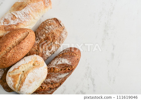 Assorted bakery products including loafs of bread Assorted bakery products including loafs of bread 111619046
