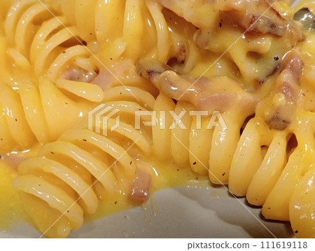 Italian short pasta with egg and bacon sauce called carbonara, a typical Roman dish. Italian food 111619118