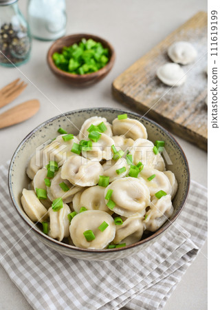 Russian pelmeni, dumplings with meat 111619199