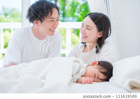 couple watching over baby couple watching over baby 111619589