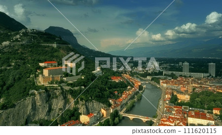 Aerial iconic shot of historic part of Grenoble involving famous Telepherique, a ropeway to Bastille Fort, France 111620115