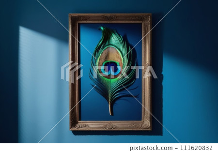 Peacock feather in a frame on a dark blue wall 111620832