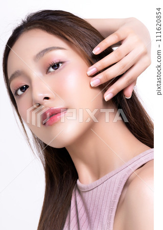 Close up beautiful longhair asian woman model with natural make up and clean fresh skin isolated on white background. Face care, Facial treatment, Cosmetology. Close up beautiful longhair asian woman model with natural make up and clean fresh skin isolated on white background. Face care, Facial treatment, Cosmetology. 111620854