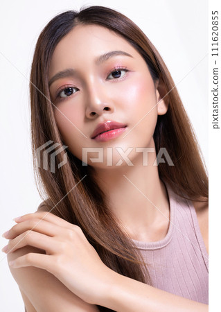 Close up beautiful longhair asian woman model with natural make up and clean fresh skin isolated on white background. Face care, Facial treatment, Cosmetology. Close up beautiful longhair asian woman model with natural make up and clean fresh skin isolated on white background. Face care, Facial treatment, Cosmetology. 111620855