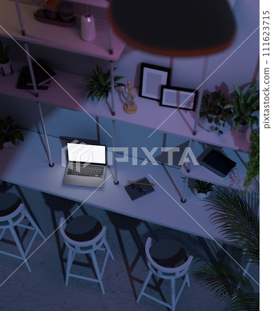 Top view of a modern dark cafe co-working space seating area at night with laptop on the table. Top view of a modern dark cafe co-working space seating area at night with laptop on the table. 111623715