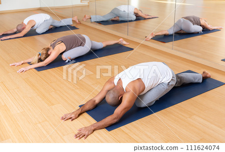 Group yoga class - pose (Balasana) Group yoga class - pose (Balasana) 111624074