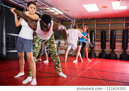 Active woman training captures on self-defense course Active woman training captures on self-defense course 111624301