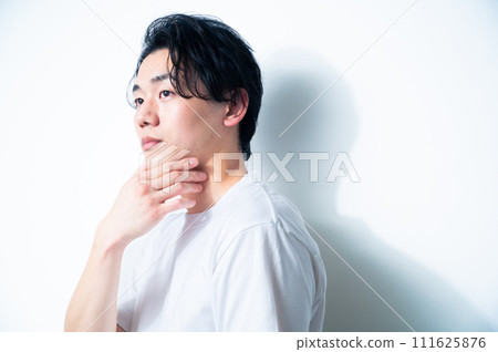 Man in white T-shirt, white background Man in white T-shirt, white background 111625876