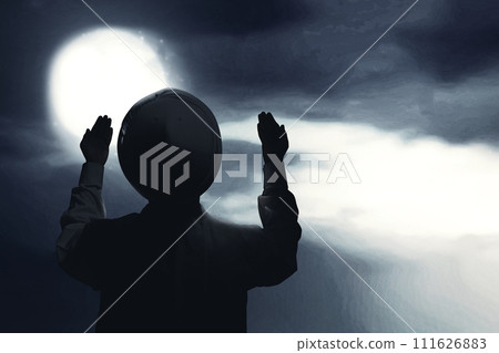 Muslim man raised her hands and prayed to Allah 111626883