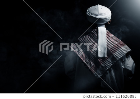 Muslim man raised her hands and prayed to Allah 111626885