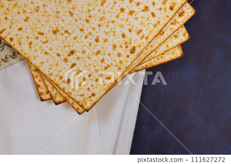 Matzah, unleavened flatbread eaten during Passover celebration, is traditional Jewish holiday 111627272