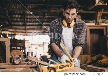 professional carpenter man hand working make wooden handcraft furniture master workpiece fine detail artisan with wood workshop. 111628146